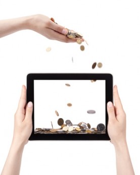 shower of coins and touch pad PC on woman hand isolated